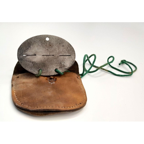 356 - A WW2 German Mountain Troop Soldiers Dog Tag in a leather Pouch to prevent the cold metal from touch... 