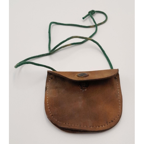 356 - A WW2 German Mountain Troop Soldiers Dog Tag in a leather Pouch to prevent the cold metal from touch... 