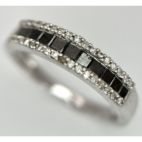 453 - A 9K WHITE GOLD DIAMOND AND SAPPHIRE THREE ROW RING. 2.2G. SIZE M.