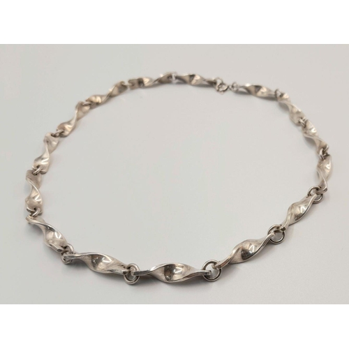 488 - A STERLING SILVER FANCY TWISTED LINK NECKLACE. 34.7G 40CM. SC5084.