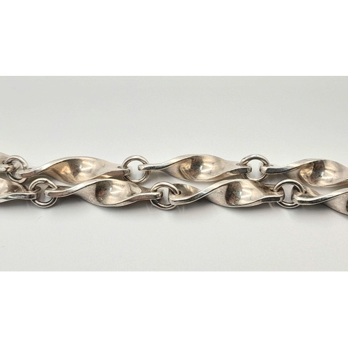 488 - A STERLING SILVER FANCY TWISTED LINK NECKLACE. 34.7G 40CM. SC5084.