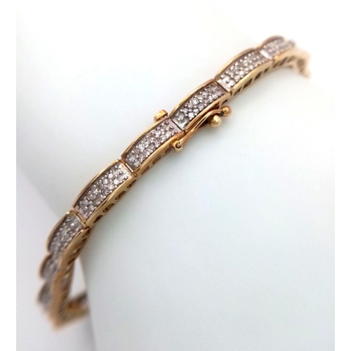 61 - A 9K YELLOW GOLD DIAMOND SET TENNIS BRACELET. 20 LINKS OF ROUND CUT DIAMONDS - 1CTW. 10G TOTAL WEIGH... 