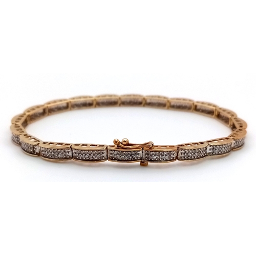 61 - A 9K YELLOW GOLD DIAMOND SET TENNIS BRACELET. 20 LINKS OF ROUND CUT DIAMONDS - 1CTW. 10G TOTAL WEIGH... 