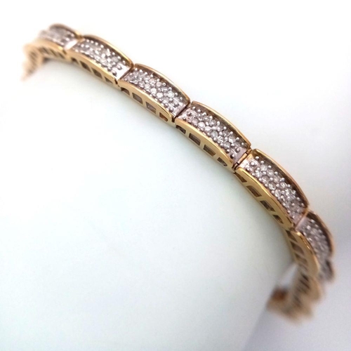 61 - A 9K YELLOW GOLD DIAMOND SET TENNIS BRACELET. 20 LINKS OF ROUND CUT DIAMONDS - 1CTW. 10G TOTAL WEIGH... 