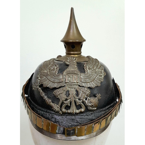 62 - A WW1 Imperial Prussian Infantry Nco’s Pickelhaube. With Cockades and chin strap. Marked “B.J.A