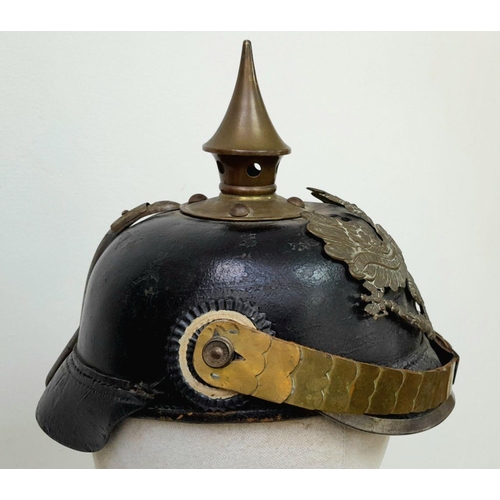 62 - A WW1 Imperial Prussian Infantry Nco’s Pickelhaube. With Cockades and chin strap. Marked “B.J.A