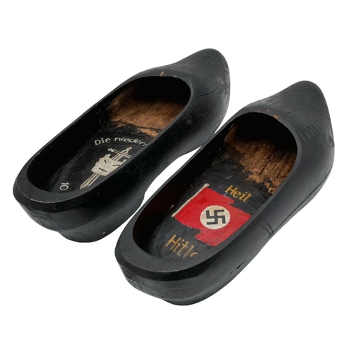 692 - A WW2 German Trench Art. A pair of Dutch Souvenir Clogs, dedicated to the Invasion of Holland by the... 