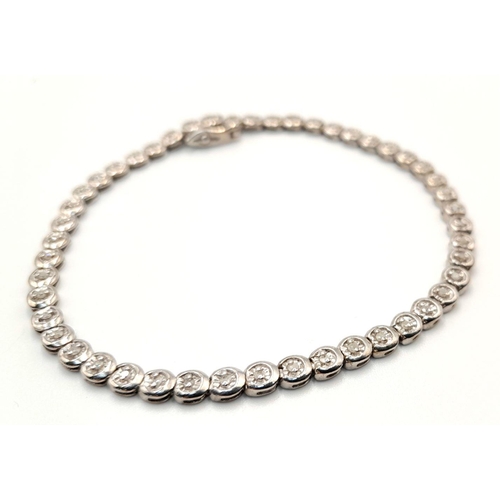 75 - A 9K WHITE GOLD DIAMOND SET TENNIS BRACELET. 0.50CTW. 8.1G TOTAL WEIGHT. 19CM. 48 DIAMONDS. 8797