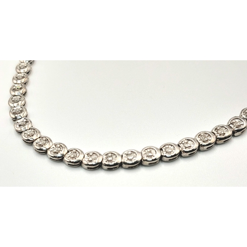 75 - A 9K WHITE GOLD DIAMOND SET TENNIS BRACELET. 0.50CTW. 8.1G TOTAL WEIGHT. 19CM. 48 DIAMONDS. 8797