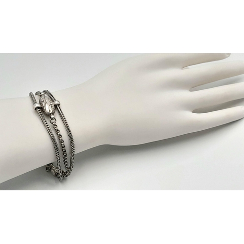 853 - A STERLING SILVER VINTAGE 3 ROW BRACELET - WITH TASSLE CHARM. 18.4G. 16CM. SC5081