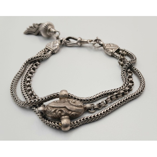 853 - A STERLING SILVER VINTAGE 3 ROW BRACELET - WITH TASSLE CHARM. 18.4G. 16CM. SC5081