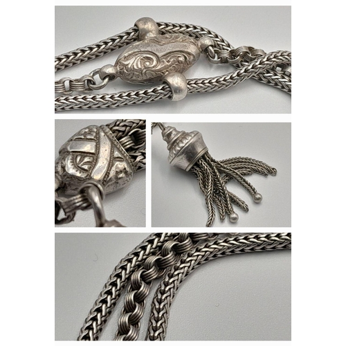 853 - A STERLING SILVER VINTAGE 3 ROW BRACELET - WITH TASSLE CHARM. 18.4G. 16CM. SC5081