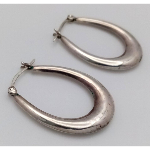 1014 - A PAIR OF STERLING SILVER OVAL SHAPED HOOP EARRINGS-3.7G. SC5075