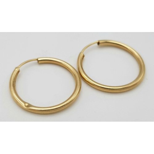 1017 - Two 9K Yellow Gold Pairs of Small Hoop Earrings. 0.65g