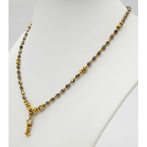 1088 - A 22K Gold Necklace with Faceted Glass Spacers. 36cm length. 10.6g total weight.