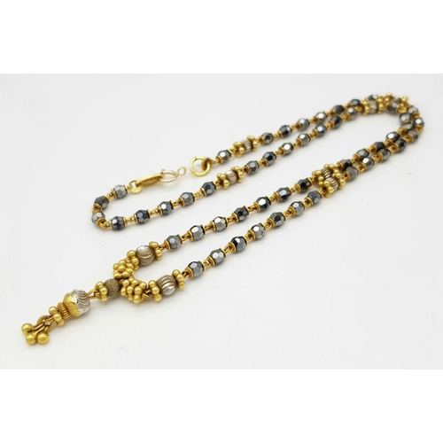 1088 - A 22K Gold Necklace with Faceted Glass Spacers. 36cm length. 10.6g total weight.