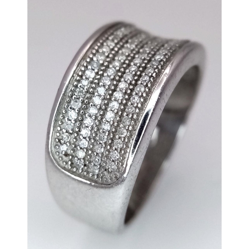 1092 - A STERLING SILVER DIAMOND SET BAND RING. 5.9G. SIZE N. SC5086