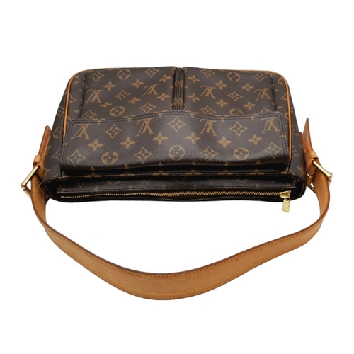 122 - A Louis Vuitton Viva Cite Shoulder Bag. Coated LV canvas exterior with two large pockets. Gold tone ... 