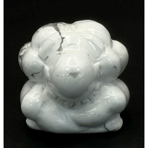 1313 - A Howlite Figurine of a Praying Man. 3.5 x 3.5m.