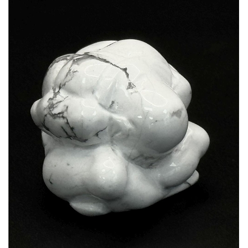 1313 - A Howlite Figurine of a Praying Man. 3.5 x 3.5m.