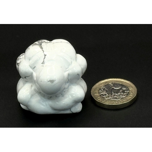 1313 - A Howlite Figurine of a Praying Man. 3.5 x 3.5m.