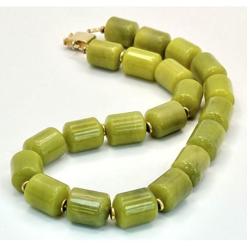 1319 - A Moss Green Jade Rondelle Beaded Necklace. Gilded spacers and clasp. 42cm.