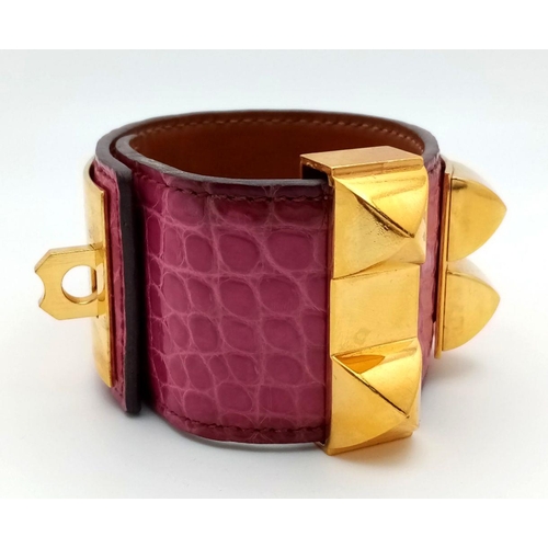 350 - A Hermes Collier de Chien Leather Bangle/Bracelet. Magenta leather with spike-stud detail. Adjustabl... 