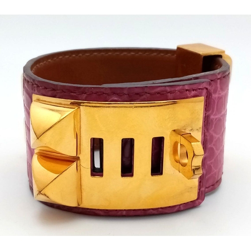 350 - A Hermes Collier de Chien Leather Bangle/Bracelet. Magenta leather with spike-stud detail. Adjustabl... 