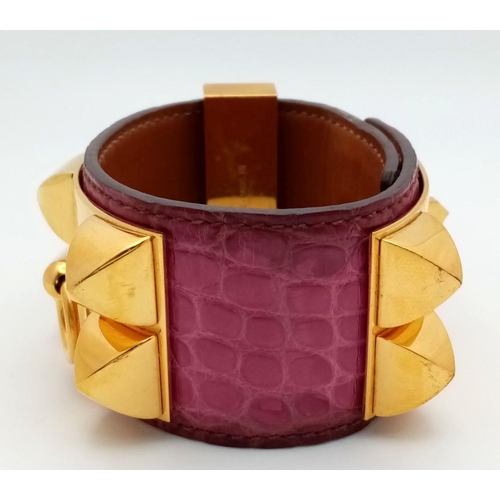 350 - A Hermes Collier de Chien Leather Bangle/Bracelet. Magenta leather with spike-stud detail. Adjustabl... 