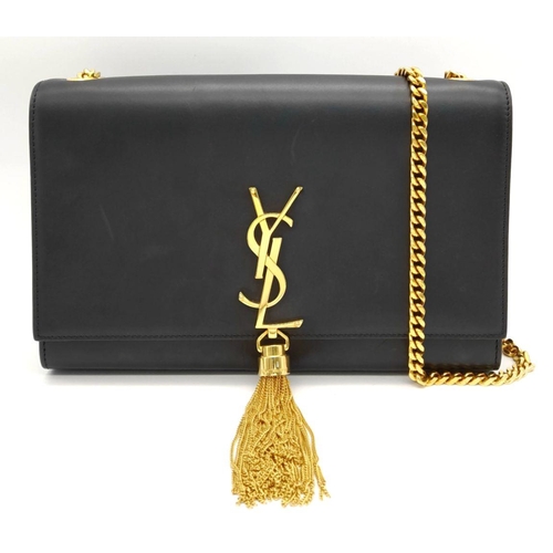 67 - A Saint Laurent Black Smooth Leather Kate Tassel Bag. Gold tone furniture. Adjustable shoulder chain... 