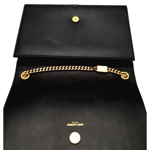 67 - A Saint Laurent Black Smooth Leather Kate Tassel Bag. Gold tone furniture. Adjustable shoulder chain... 