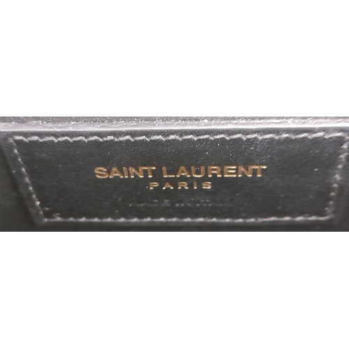 67 - A Saint Laurent Black Smooth Leather Kate Tassel Bag. Gold tone furniture. Adjustable shoulder chain... 