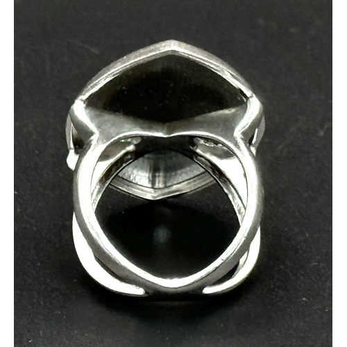 993 - A STERLING SILVER MARQUISE SHAPED MATT FINISH RING. 16G. SIZE O. SC5072