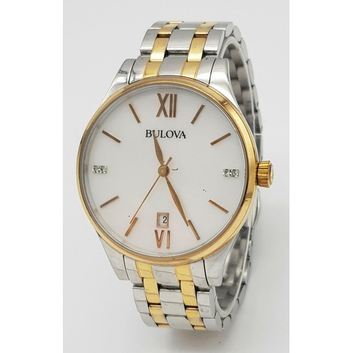 1293 - A BULOVA BI-METAL GENTS WATCH WITH MOTHER OF PEARL DIAL , QUARTZ MOVEMENT AND IN VERY GOOD CONDITION... 