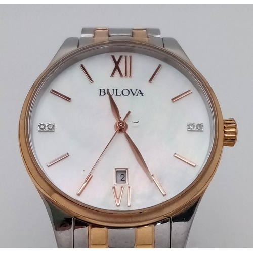 1293 - A BULOVA BI-METAL GENTS WATCH WITH MOTHER OF PEARL DIAL , QUARTZ MOVEMENT AND IN VERY GOOD CONDITION... 