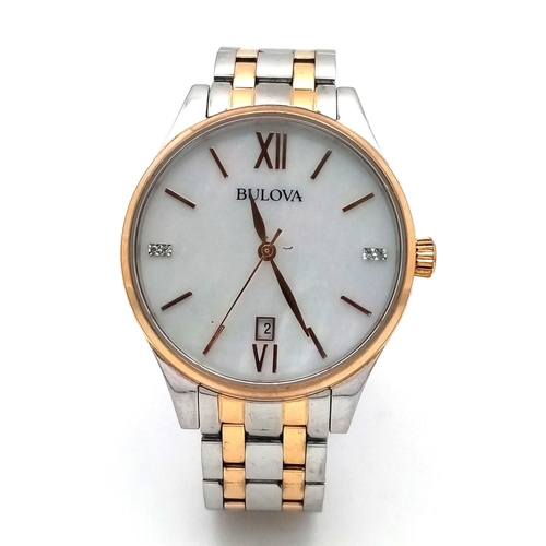 1293 - A BULOVA BI-METAL GENTS WATCH WITH MOTHER OF PEARL DIAL , QUARTZ MOVEMENT AND IN VERY GOOD CONDITION... 