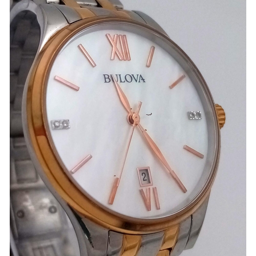 1293 - A BULOVA BI-METAL GENTS WATCH WITH MOTHER OF PEARL DIAL , QUARTZ MOVEMENT AND IN VERY GOOD CONDITION... 