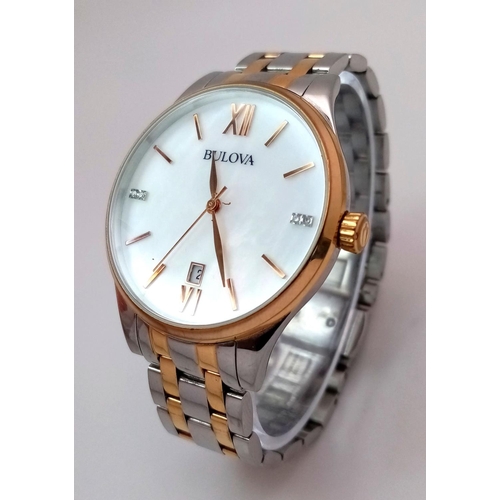 1293 - A BULOVA BI-METAL GENTS WATCH WITH MOTHER OF PEARL DIAL , QUARTZ MOVEMENT AND IN VERY GOOD CONDITION... 