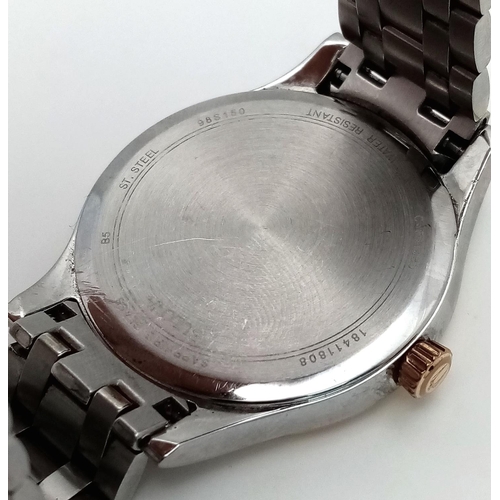 1293 - A BULOVA BI-METAL GENTS WATCH WITH MOTHER OF PEARL DIAL , QUARTZ MOVEMENT AND IN VERY GOOD CONDITION... 