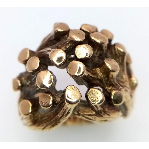 22 - An Abstract 9K Gold Heavy Ring. Foliage-esque design. Size K 1/2. 16.9g weight.