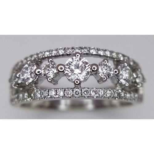 247 - A 14k White Gold and Diamond Three Row Ring. 1ctw of quality diamonds in brilliant and round cuts in... 