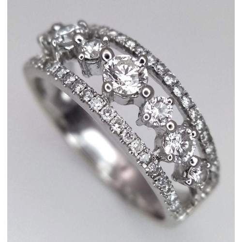 247 - A 14k White Gold and Diamond Three Row Ring. 1ctw of quality diamonds in brilliant and round cuts in... 