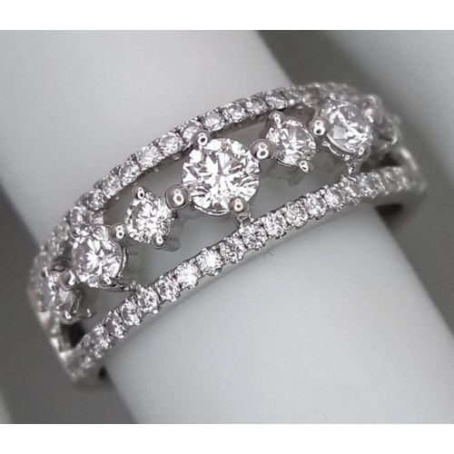 247 - A 14k White Gold and Diamond Three Row Ring. 1ctw of quality diamonds in brilliant and round cuts in... 