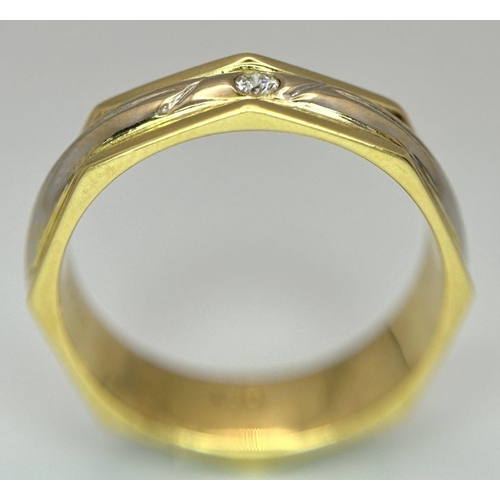 249 - An 18K Yellow and White Gold Octagonal Band Ring with a solitary 0.10ct round cut diamond. Size P 1/... 