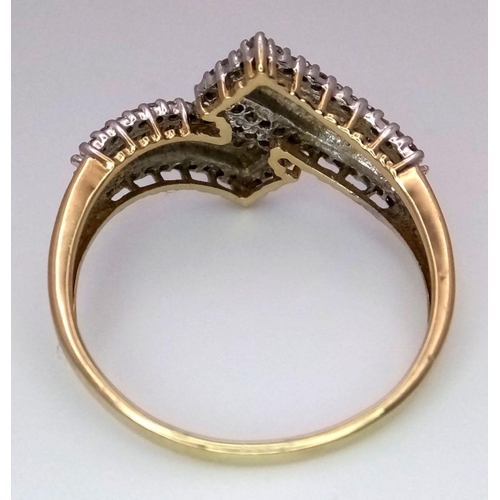 268 - A 9K Yellow Gold Diamond Crossover Ring. Six rows of tapered baguette and round cut diamonds create ... 