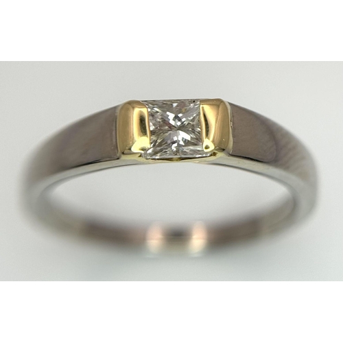 275 - An 18K White and Yellow Gold, Diamond Solitaire Ring. A 0.43ct (approx) Princess cut diamond sits be... 