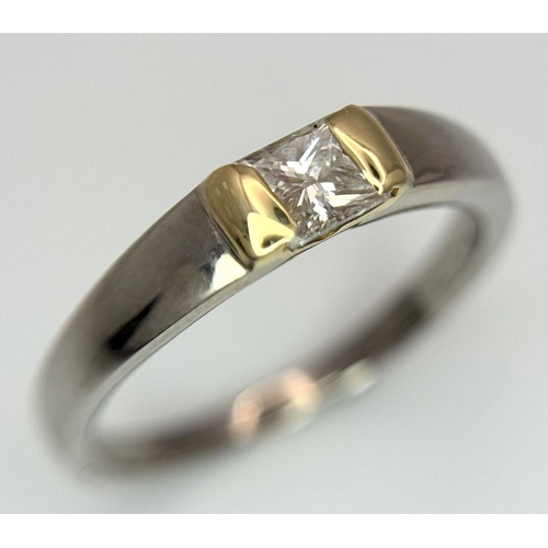 275 - An 18K White and Yellow Gold, Diamond Solitaire Ring. A 0.43ct (approx) Princess cut diamond sits be... 