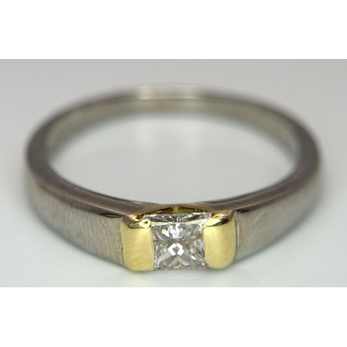 275 - An 18K White and Yellow Gold, Diamond Solitaire Ring. A 0.43ct (approx) Princess cut diamond sits be... 