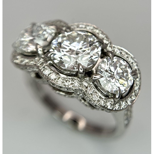 289 - A Head-Turning 18K White Gold and Lab Diamond Dress Ring. Three remarkable VS1 brilliant round cut d... 