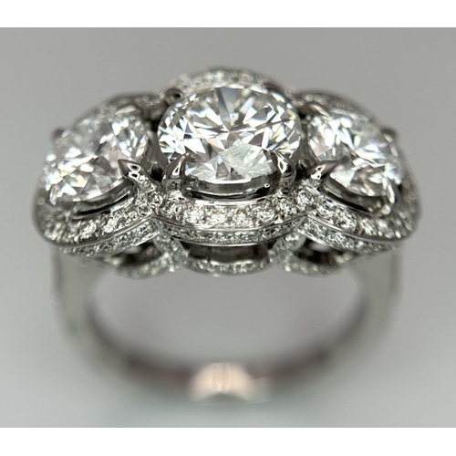 289 - A Head-Turning 18K White Gold and Lab Diamond Dress Ring. Three remarkable VS1 brilliant round cut d... 